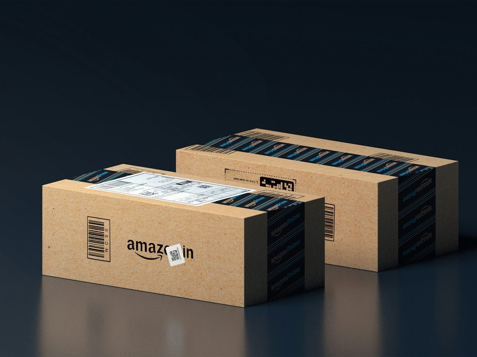 2 amazon boxes on dark table with black background