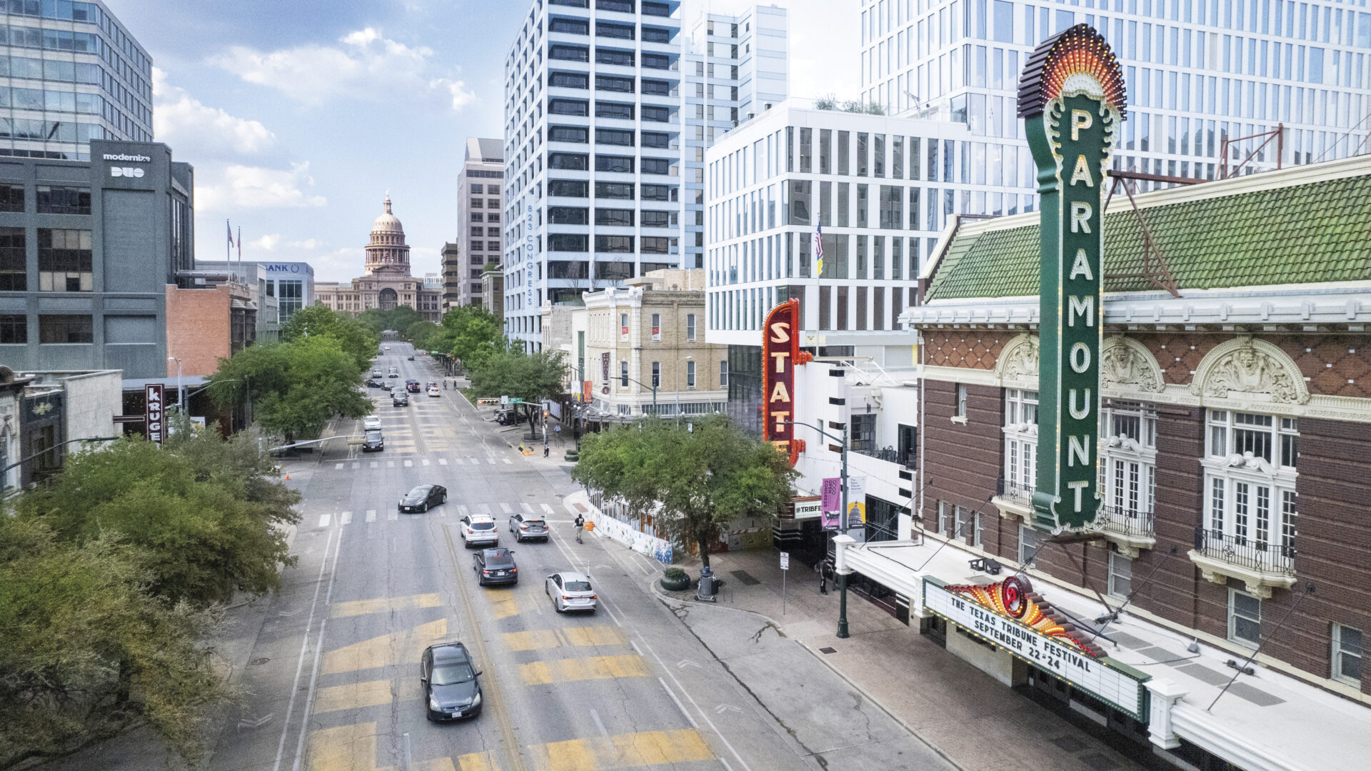 View of South Congress Avenue in Austin Texas with Paramount Theater sign and state capitol building in view