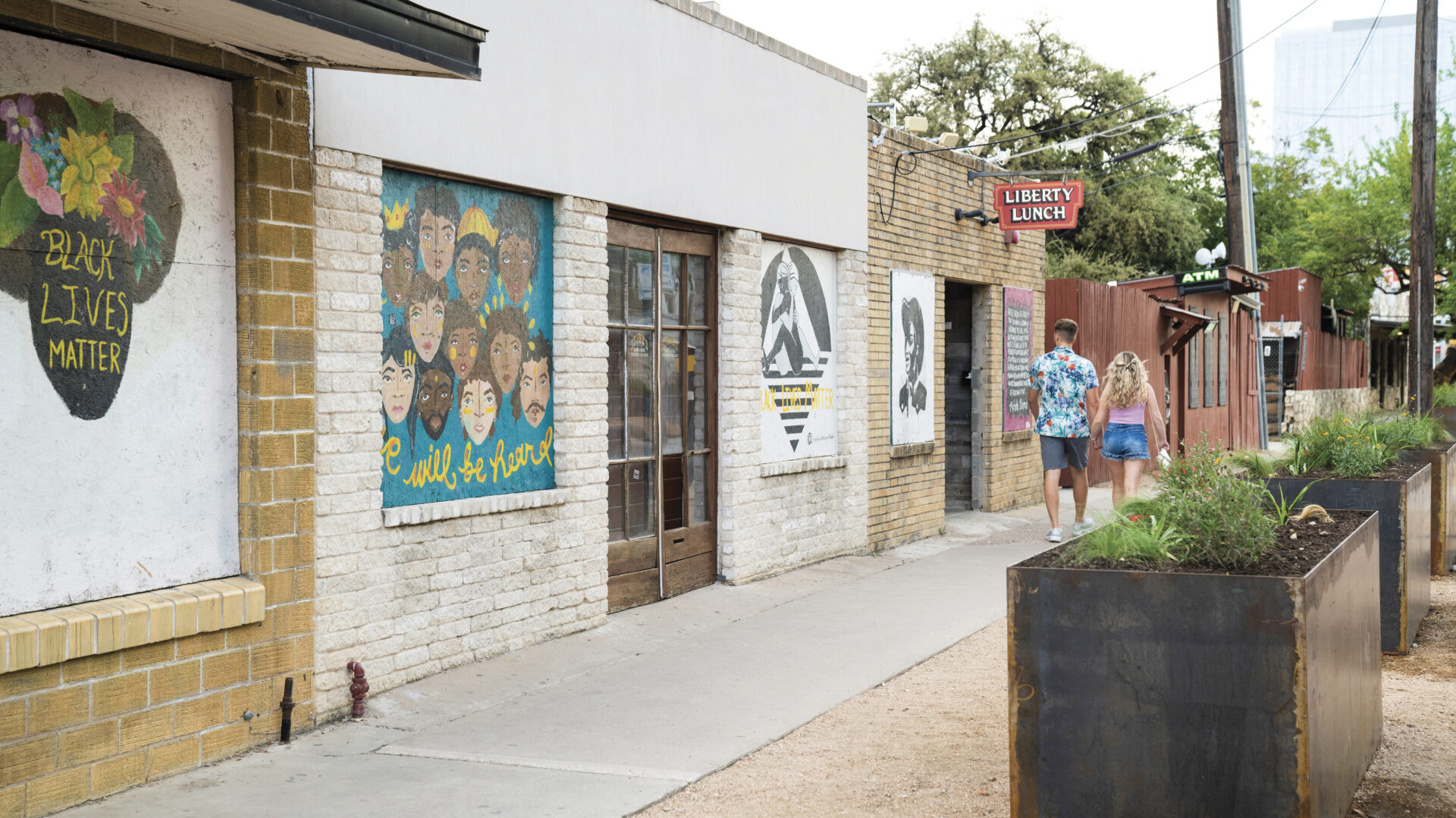 brick buildings with murals in Red River District in Austin 