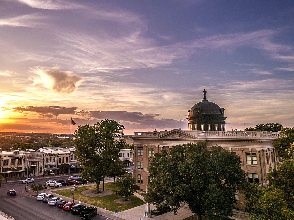 Birdseye view of Georgetown capital area at sunset for article Georgetown: The Best of Small-Town Life Near Austin for newcomers moving to Austin.