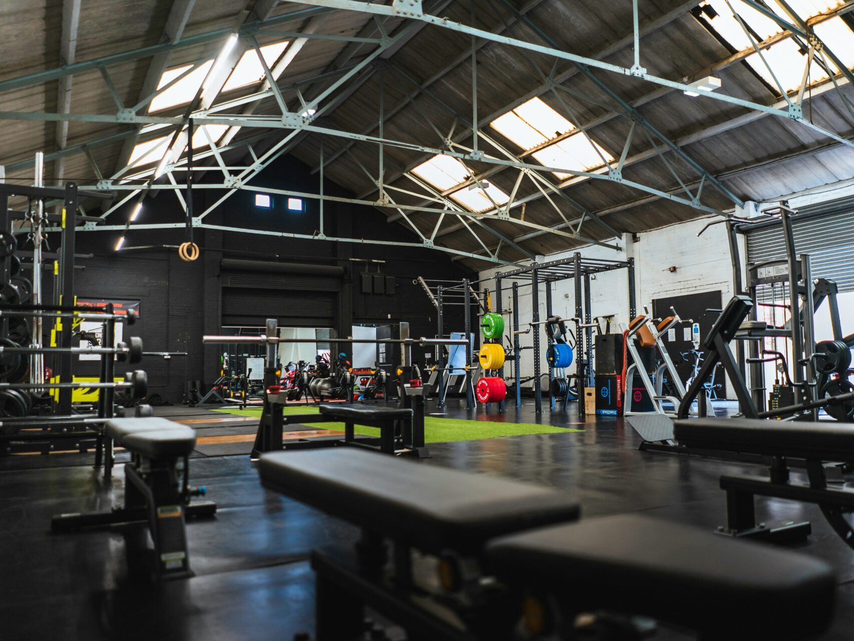 Indoor weight room facility with different equipment.