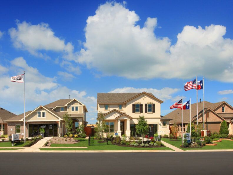 3 Houses with a united states flag