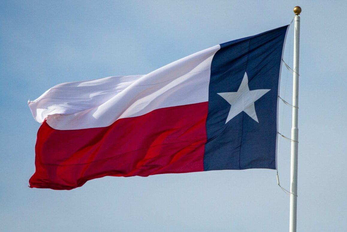 texas flag flying in the wind