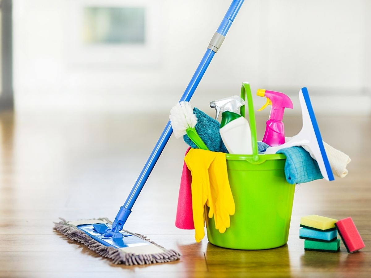 Bucket of cleaning supplies.