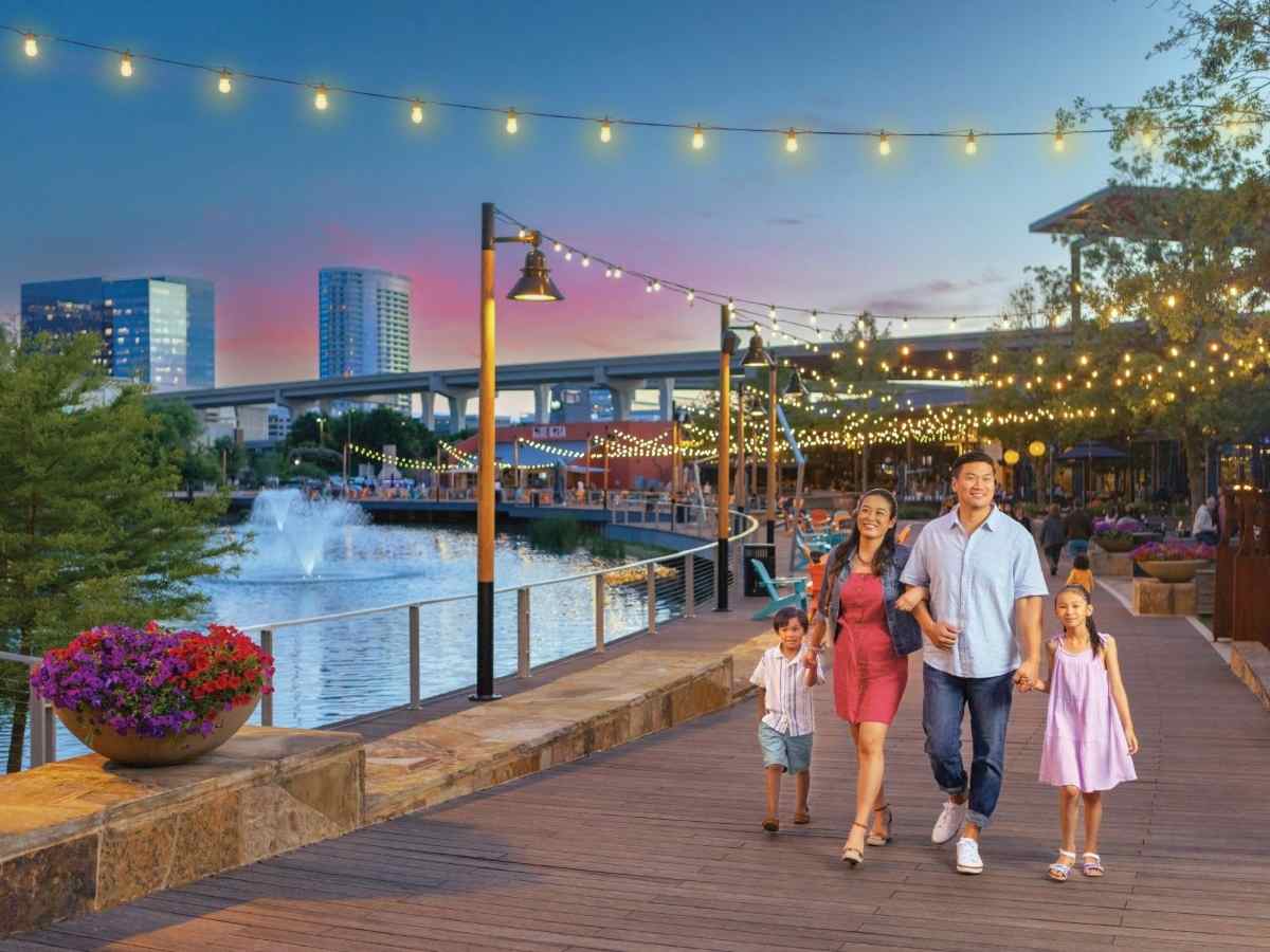Family walking on boardwalk in Plano.