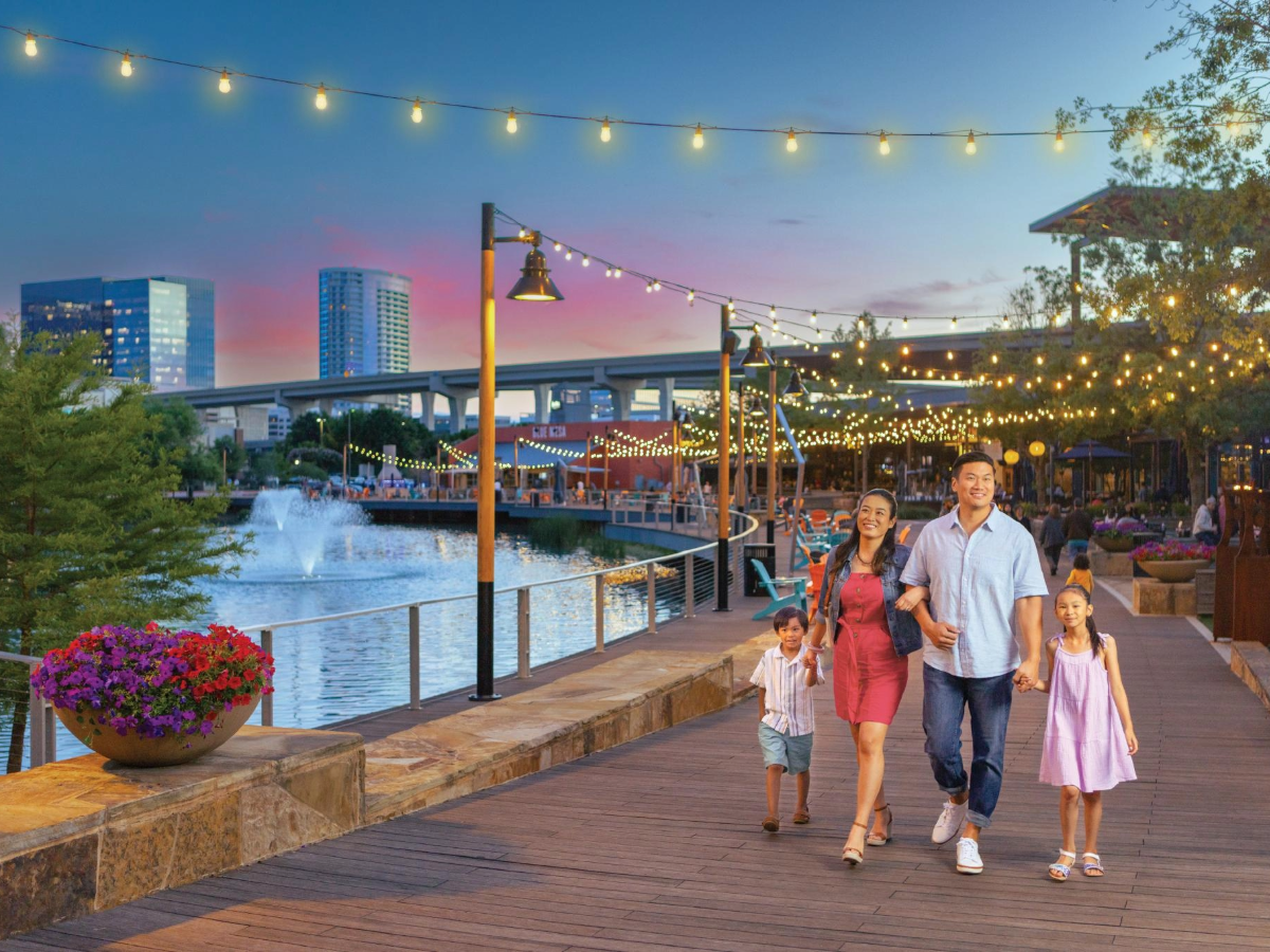 Family walking on boardwalk in Plano.