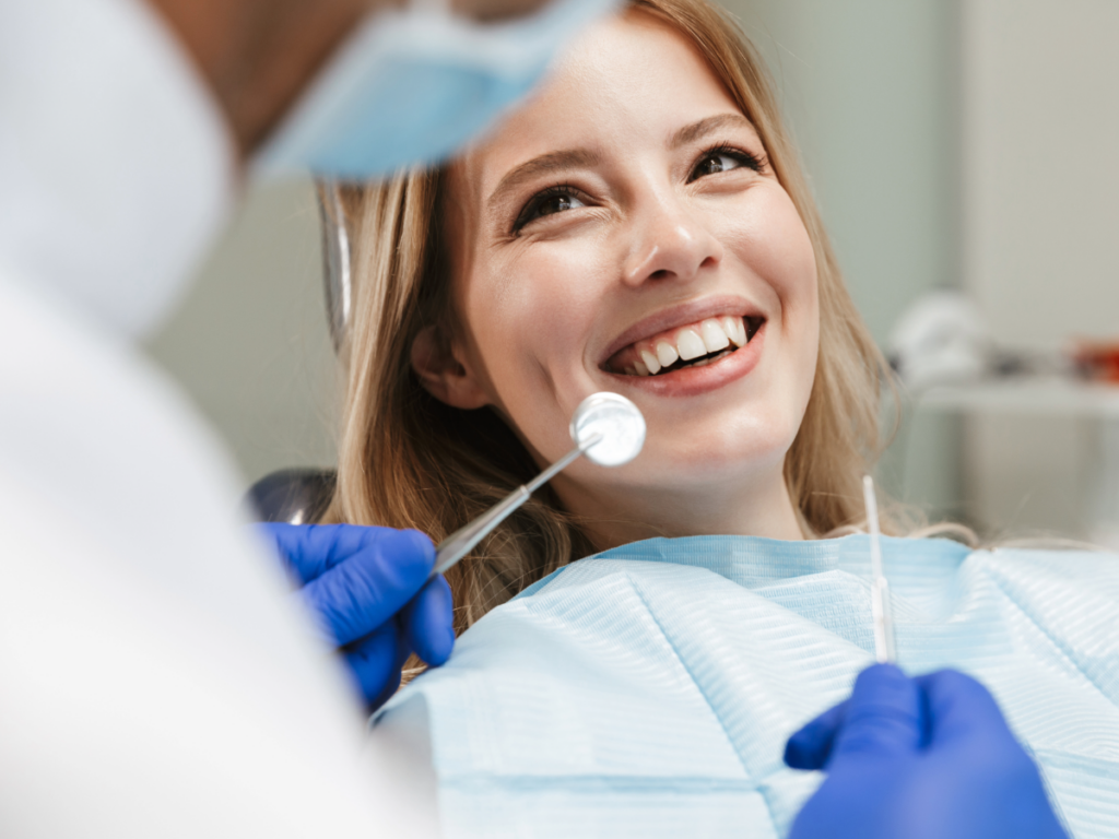 Close up of female in dental chair for Finding dentists in Austin for newcomers moving to Austin.