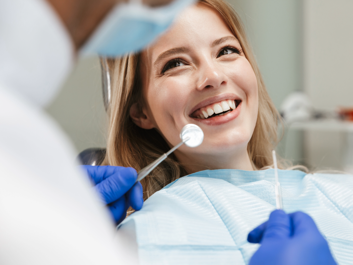 Close up of female in dental chair for Finding dentists in Austin for newcomers moving to Austin.