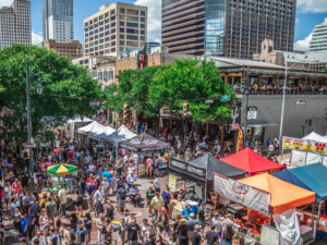 Diverse crowd at outdoor festival in Austin for article Austin Demographic Information for newcomers moving to Austin.