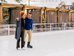 Couple ice skating for article Austin Ranks 6th Most Fun City in America for newcomers moving to Austin.