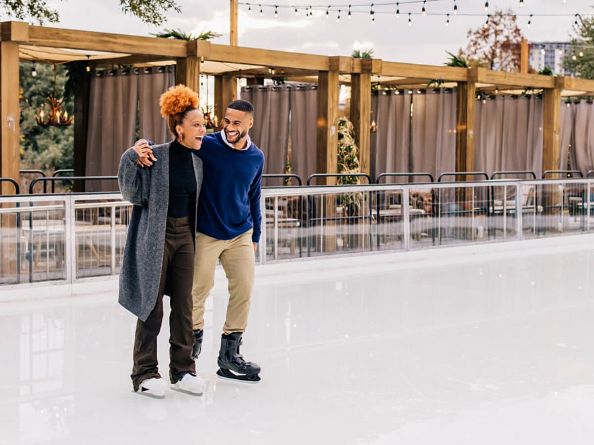 Couple ice skating for article Austin Ranks 6th Most Fun City in America for newcomers moving to Austin.