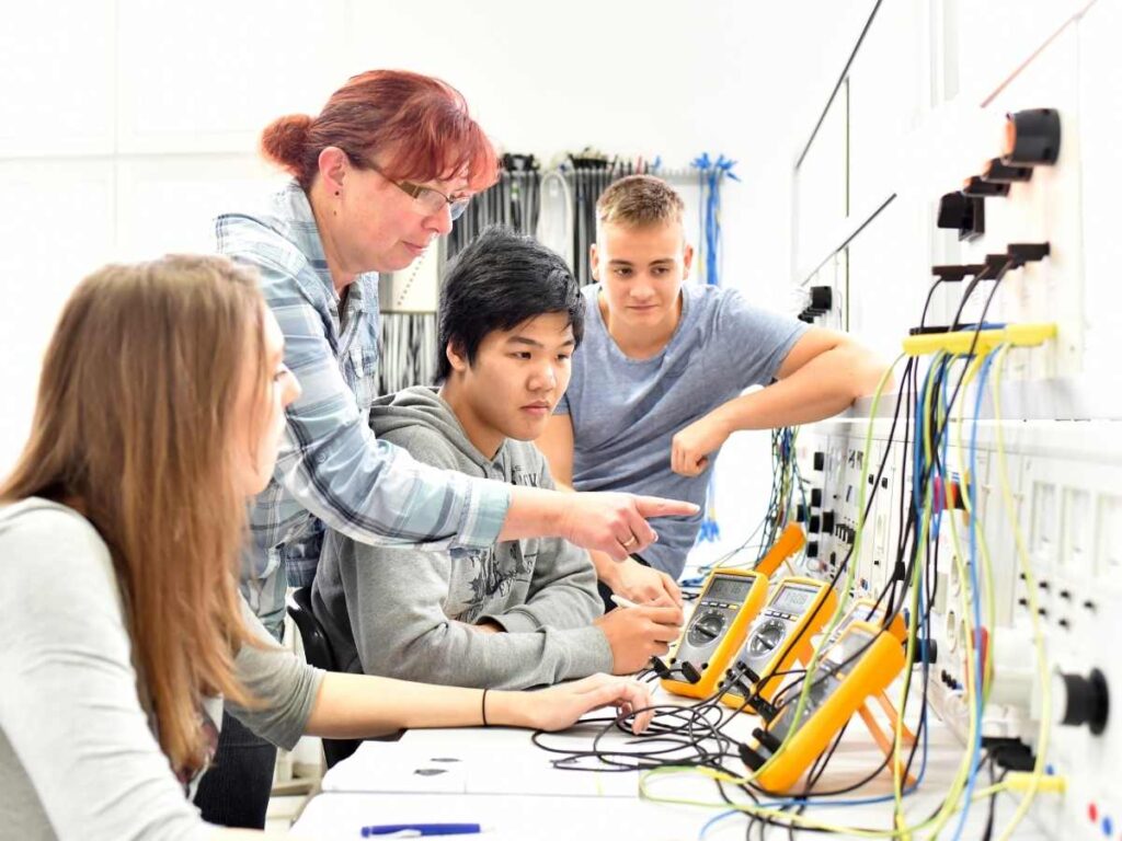 Technical vocational training in industry showing young apprentices and trainers in the classroom for article Technical, Trade, and Vocational Schools in Austin for newcomers moving to Austin.