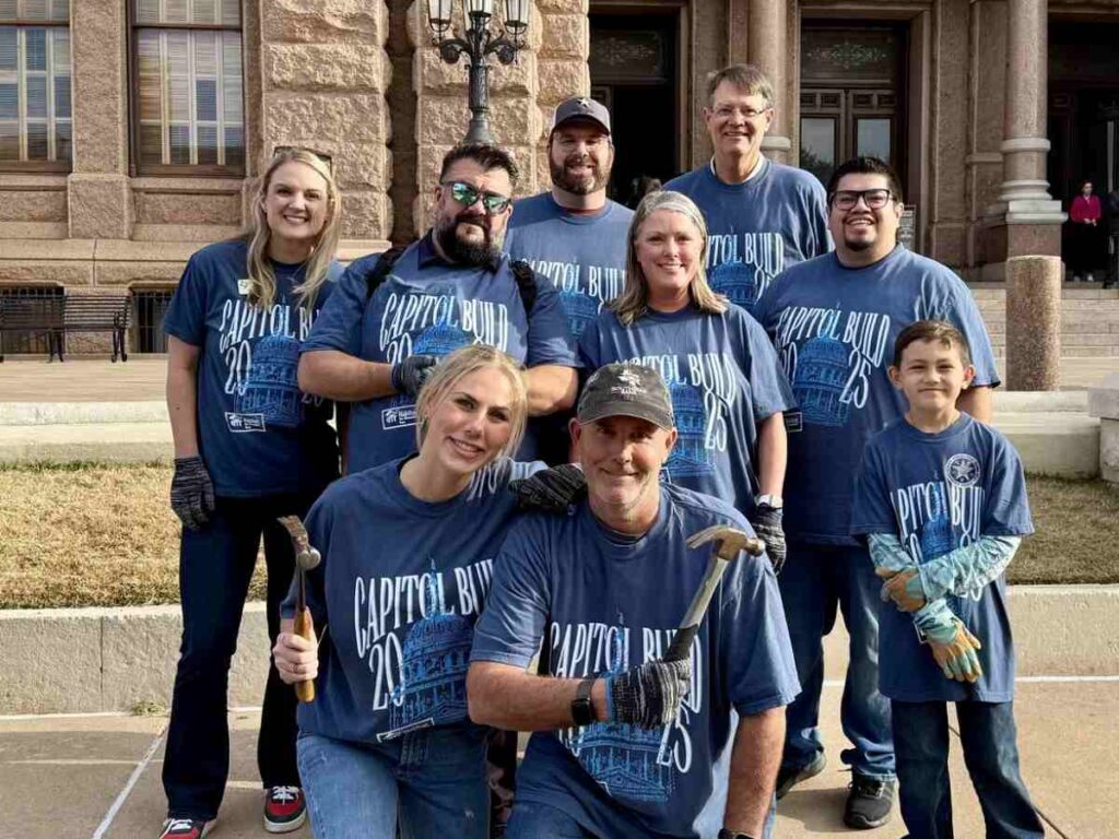 Picture of employees volunteering and posing for a group picture for article Unlocking Your Financial Potential with SouthStar Bank in Austin, TX for newcomers moving to Austin.
