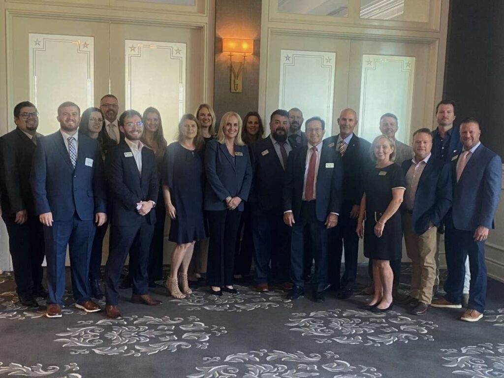 Group of employees posing for picture for article Unlocking Your Financial Potential with SouthStar Bank in Austin, TX for newcomers moving to Ausitn.