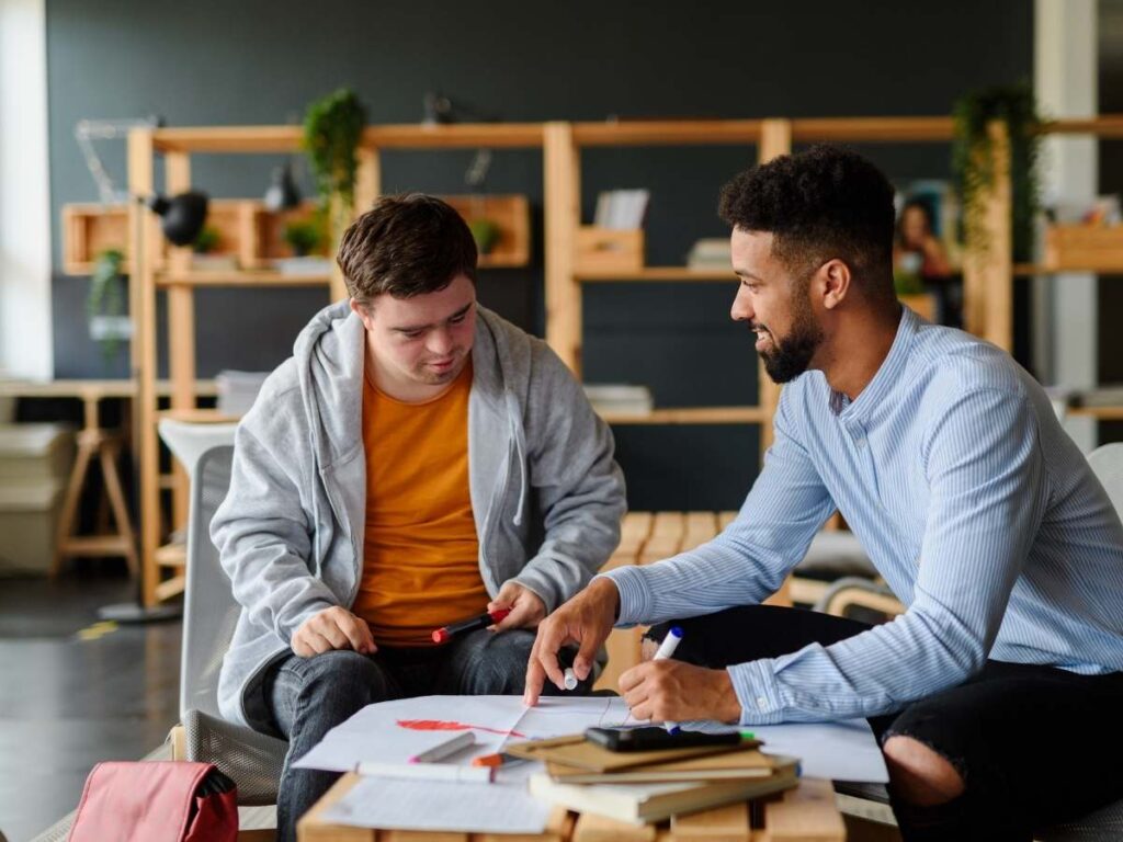Special needs child receiving school help from teacher for article Special Needs Resources in Austin for newcomers moving to Austin or moving within the Austin area.