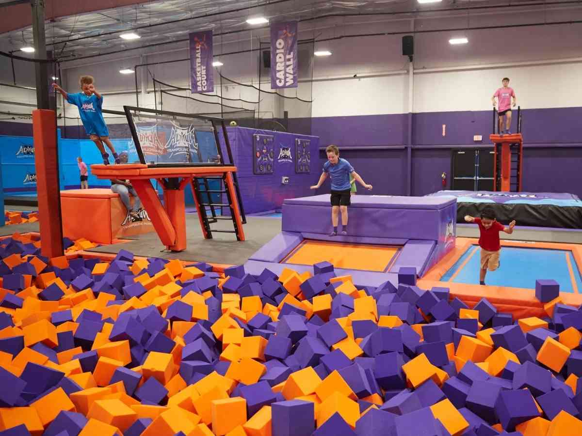 Things to Do in Austin with Kids A group of kids jumping on a trampoline for article Things to Do in Austin with Kids for newcomers moving to Austin.