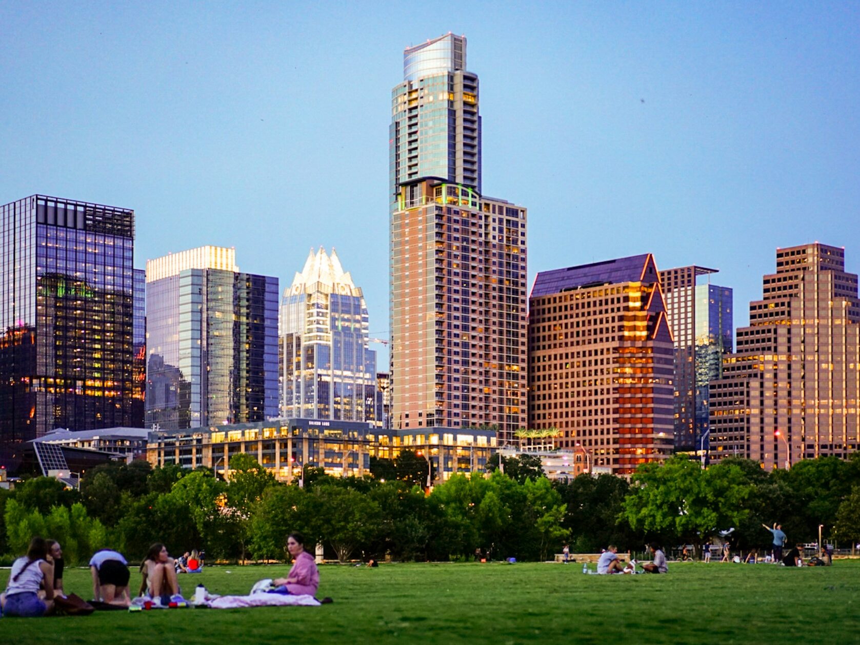 People sitting in a park in Austin, Best Apartments in Austin