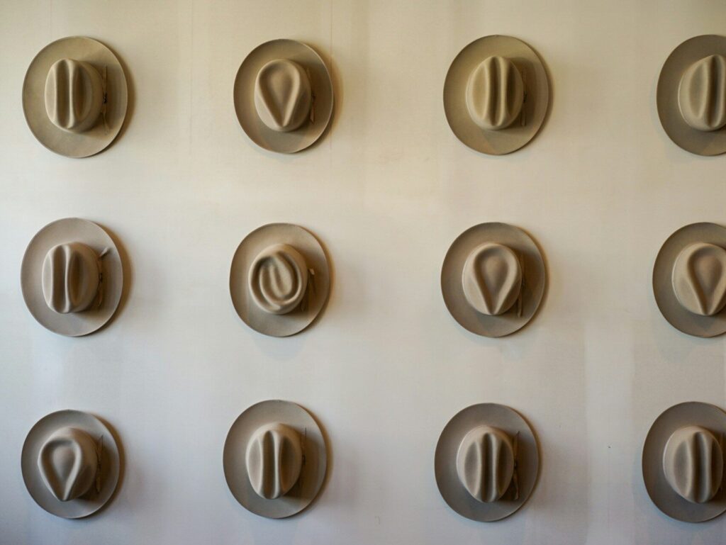 Cowboy hats on a wall. Why is Austin weird?