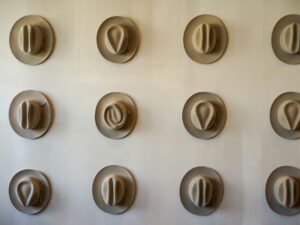 Cowboy hats on a wall. Why is Austin weird?