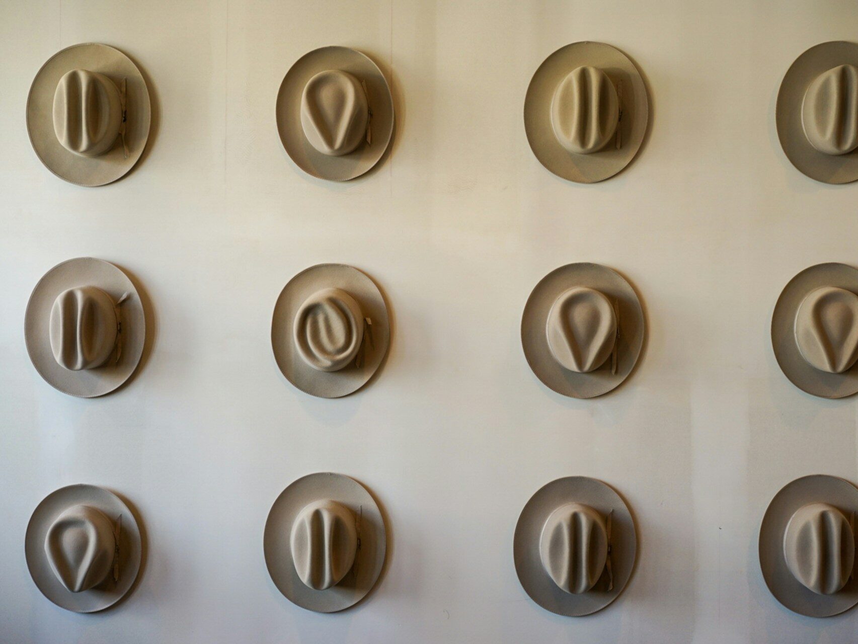 Cowboy hats on a wall. Why is Austin weird?